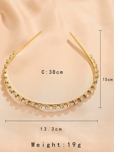 Detailed view of slim gold metal headband with sparkling clear rhinestones and dimensions