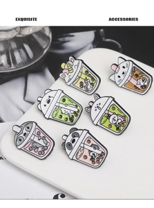 Detailed collection of six cute animal milk tea enamel pins on a white display board