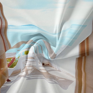 Macro detail of Bohemian landscape wall tapestry showing soft fabric texture and ocean view