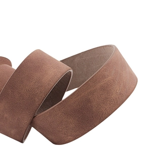 Classic brown leather belt for women featuring a minimalist round buckle and vintage texture
