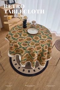Detailed texture of sunflower jacquard fabric with white fringe tassels on round tablecloth