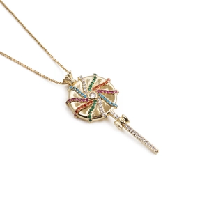 Detail of gold lollipop pendant with colorful crystals and a fine box chain