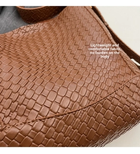 Macro shot of brown woven faux leather texture on this stylish large capacity tote bag
