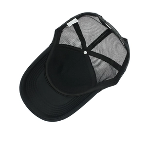 Detailed internal view of black mesh trucker hat showing adjustable strap and stitching
