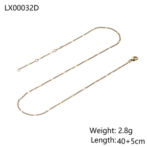Detailed view of gold snake bone chain with lobster clasp and adjustable extension link