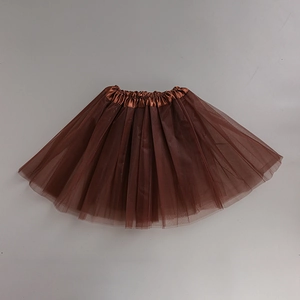 Detailed flat lay of brown three-layer mesh tutu skirt with elastic satin waistband