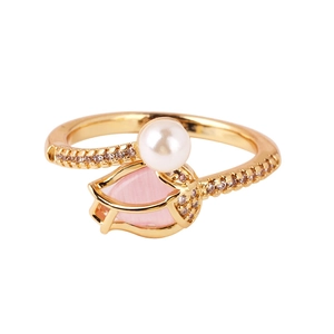 Detailed view of tulip ring with pink cat eye stone, white pearl, and pavé diamonds
