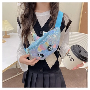 Detail of blue sequin unicorn waist bag for kids with embroidered eyes and 3D horn