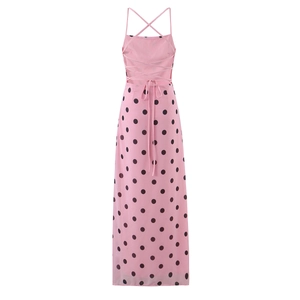 Detail of pink polka dot dress showing open back design and crisscross straps