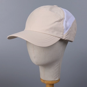 Detailed side view of breathable mesh panel on khaki outdoor sun hat for running
