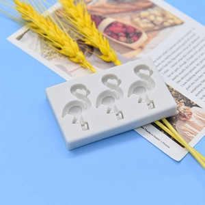 Food-grade grey flamingo silicone ice cream mold with three heart-shaped cavities