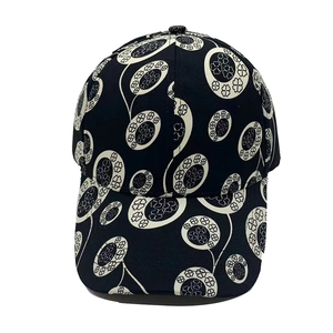 Classic black and white baseball cap with clover pattern and curved brim on white background