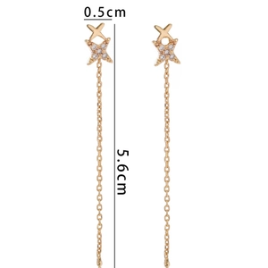Long gold tassel earrings with cross star motif and shimmering white cubic zirconia stones