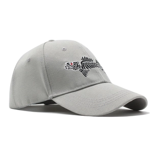 Detail of 3D fish bone embroidery on grey cotton baseball cap with red eye accent