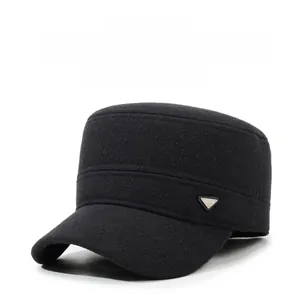 Close-up of a men's black winter wool cap featuring an earflap and a metal triangle logo
