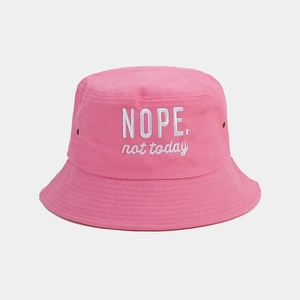 Detail of pink cotton bucket hat with white 'NOPE. not today' embroidery and metal eyelets