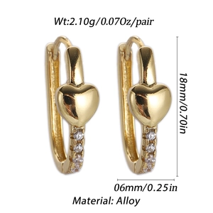 Detail view of gold heart hoop earrings with dimensions 18mm by 6mm and 2.10g weight
