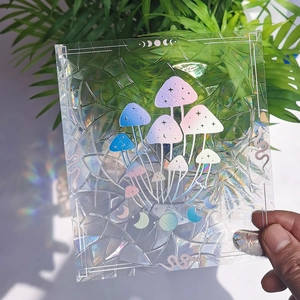 Rainbow prism suncatcher film featuring holographic mushroom and moon phase designs