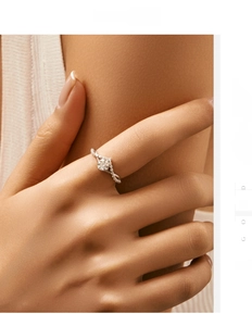 Macro detail of elegant twisted silver band ring with round moissanite on model hand