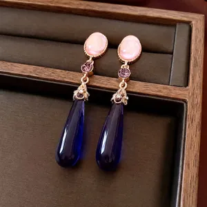 Vintage gold drop earrings with pink, purple, and deep blue waterdrop crystals