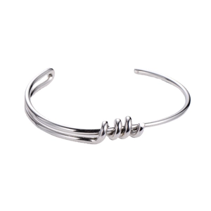 Minimalist silver knot bangle in polished titanium steel with elegant spiral center design