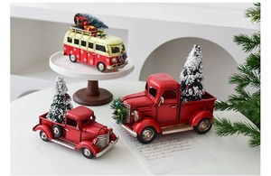 Macro detail of vintage metal Christmas car models with mini trees and gift boxes