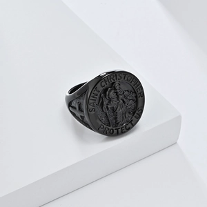 Vintage black stainless steel Saint Christopher relief seal ring on white geometric background