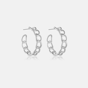 Macro detail of S925 sterling silver chain link hoop earrings with reflective finish