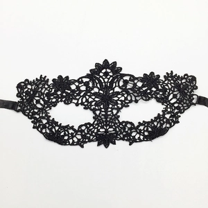 Classic black lace masquerade mask with intricate patterns and elegant side ribbon ties