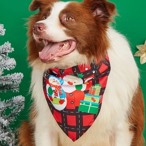 Christmas pet bandana with red plaid and Santa patterns on a Border Collie dog