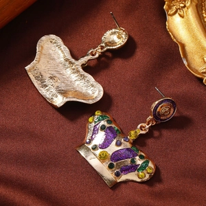 Golden crown stud earrings with purple glitter and colorful rhinestones on silk