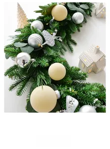 Close-up of 60cm Christmas wreath with pine leaves, silver ornaments and warm LED lights