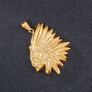 Macro shot of hip hop style gold plated Indian headdress skull pendant in stainless steel