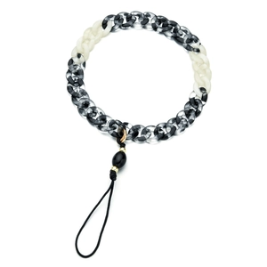 Detail of acrylic phone chain with marble pattern links and gold metal connector