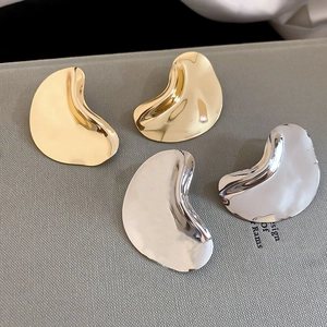 Minimalist organic geometric teardrop earrings in polished gold and silver metal finishes