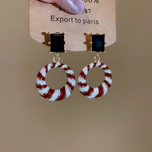Vintage geometric drop earrings with black crystal and red white enamel spiral pattern