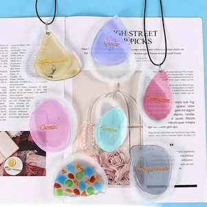 DIY resin zodiac constellation pendants with glitter and heart silicone mold on magazine