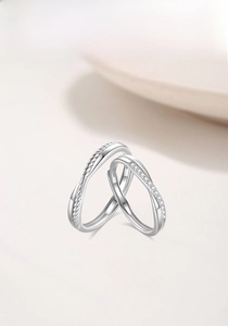Close-up of S925 silver Mobius rings showing braided texture and paved cubic zirconia
