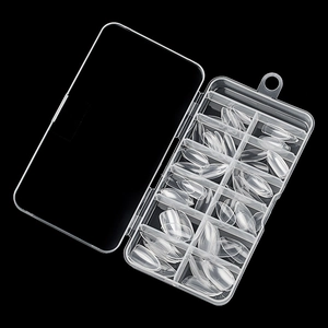 Set of 120 clear almond nail tips stored in a 12-grid transparent plastic organizer box