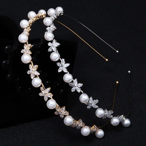 Detail of luxury headbands with inlaid pearls and zircon flowers in gold and silver