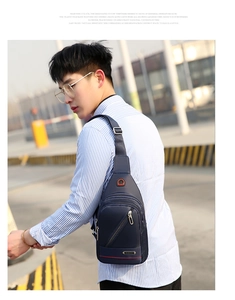 Detailed view of dark blue waterproof oxford chest bag on male model in outdoor setting
