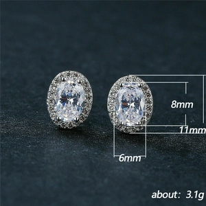 Elegant oval halo stud earrings with 8x6mm cubic zirconia and sparkling silver finish