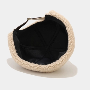 Minimalist beige sherpa docker hat with brown leather strap and warm fleece lining