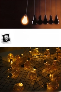 Close-up of golden LED globes with warm copper wire filaments for festive decoration
