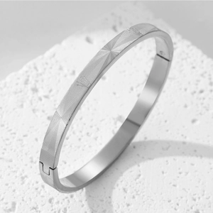 Modern silver titanium steel bracelet with geometric crown grid texture and buckle clasp