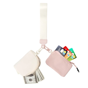 Wristlet set with beige coin pouch and pink card holder showing internal storage capacity