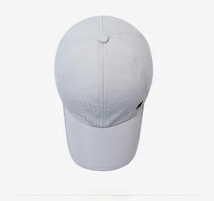 Top view of light grey quick-dry baseball cap showing laser-cut side ventilation holes