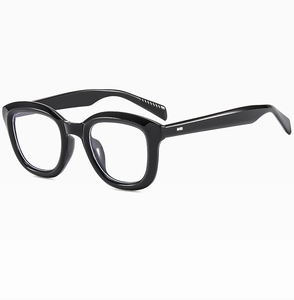 Detail of glossy black round frames and sturdy hinges on vintage sunglasses