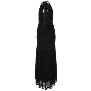 Detailed view of black polka dot mesh maxi dress featuring halter neck and layered pleats