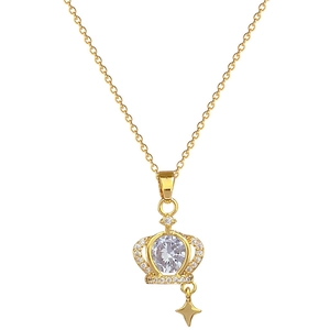 Luxurious gold titanium crown necklace with sparkling crystals and star pendant on white